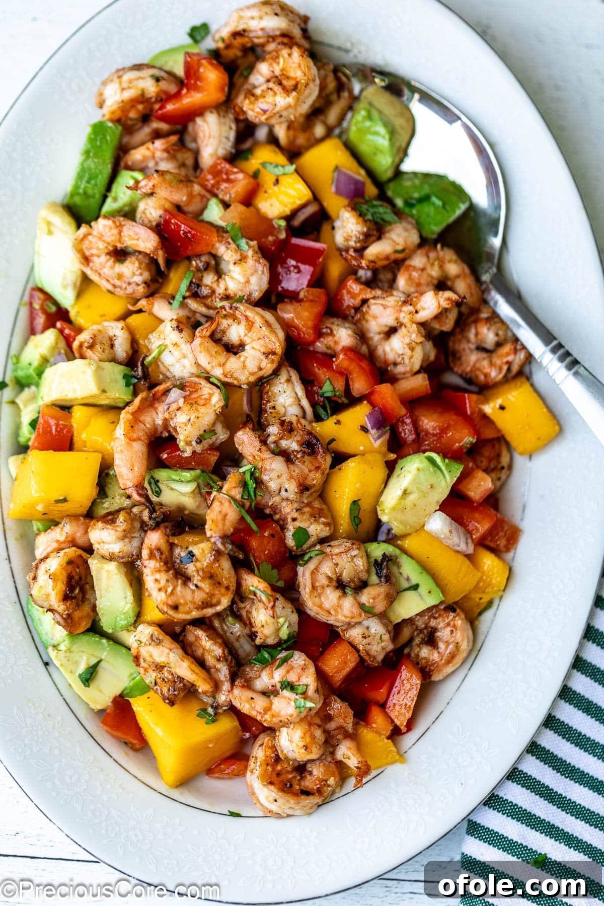 Tropical Mango Prawn Salad 8 Tossed Mango Shrimp Salad, perfectly dressed and ready to be served.