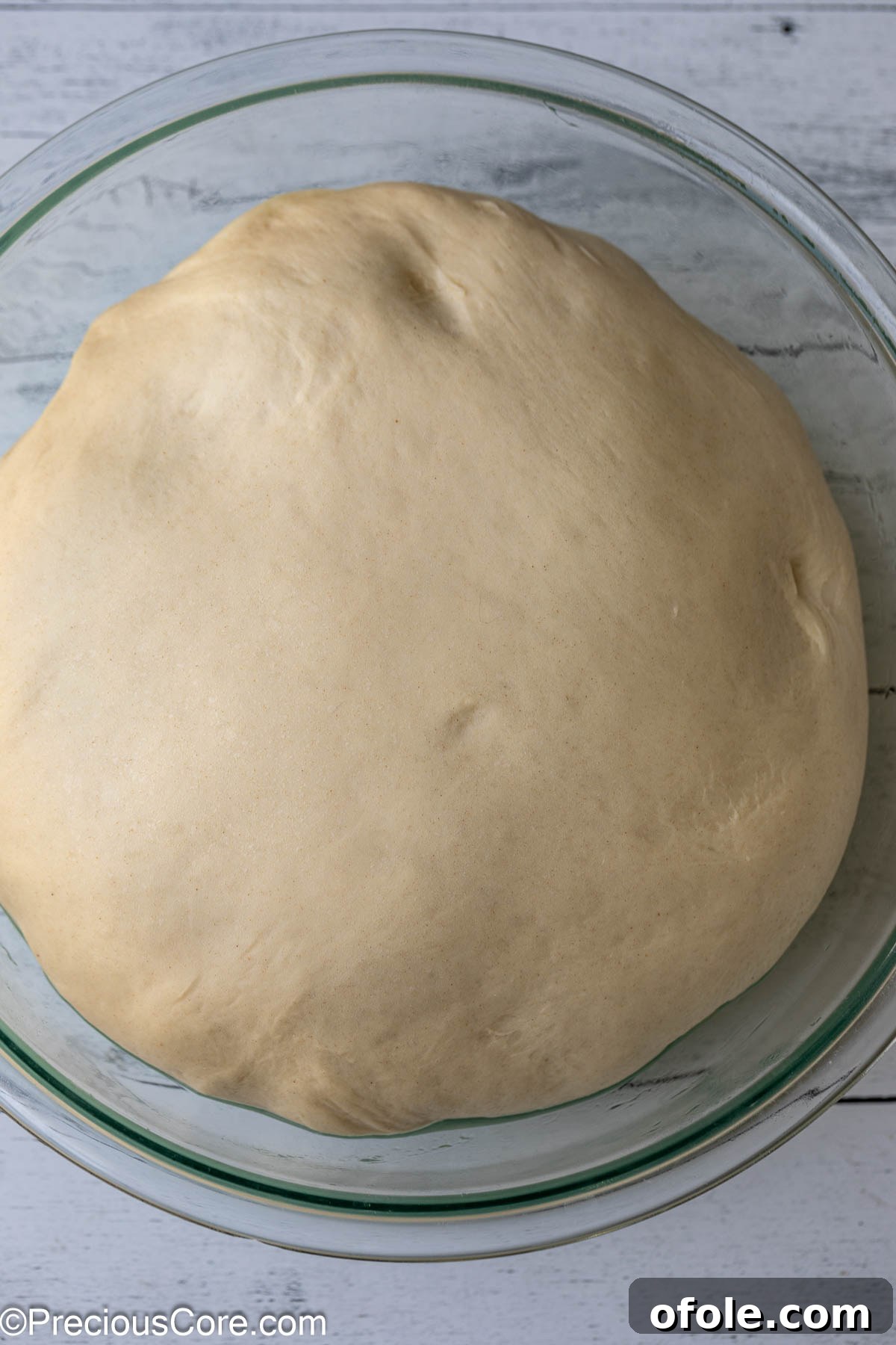 Luscious Strawberry Cinnamon Rolls 11 Risen, doubled cinnamon roll dough in a bowl, ready for shaping.