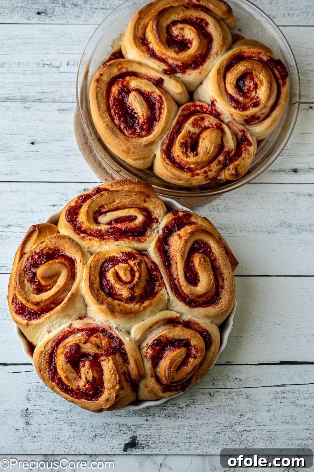 Luscious Strawberry Cinnamon Rolls 17 Baked golden brown strawberry cinnamon rolls in a round baking dish, fresh from the oven.