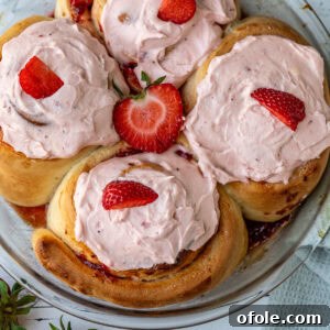 Frosted strawberry cinnamon rolls, highlighting their delicious appeal.