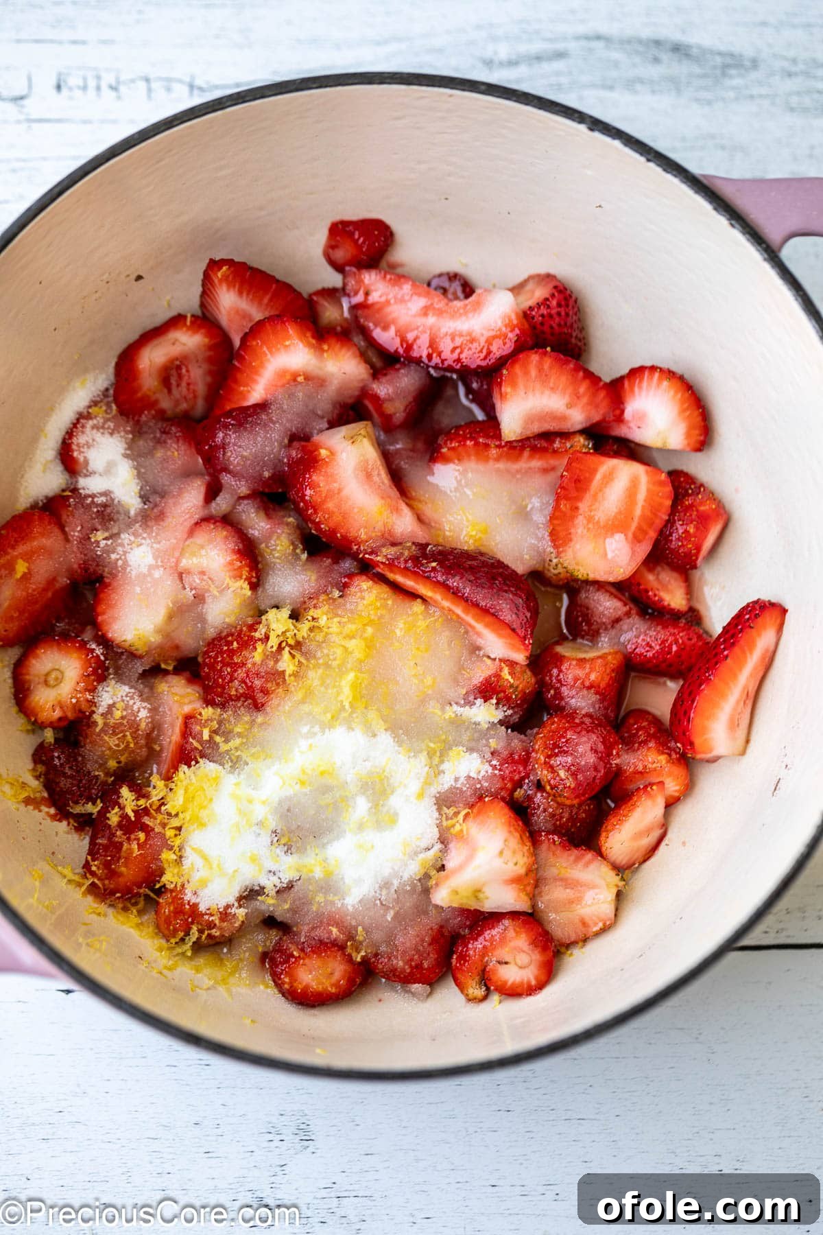 Luscious Strawberry Cinnamon Rolls 7 Fresh ingredients for strawberry compote cooking in a saucepan.