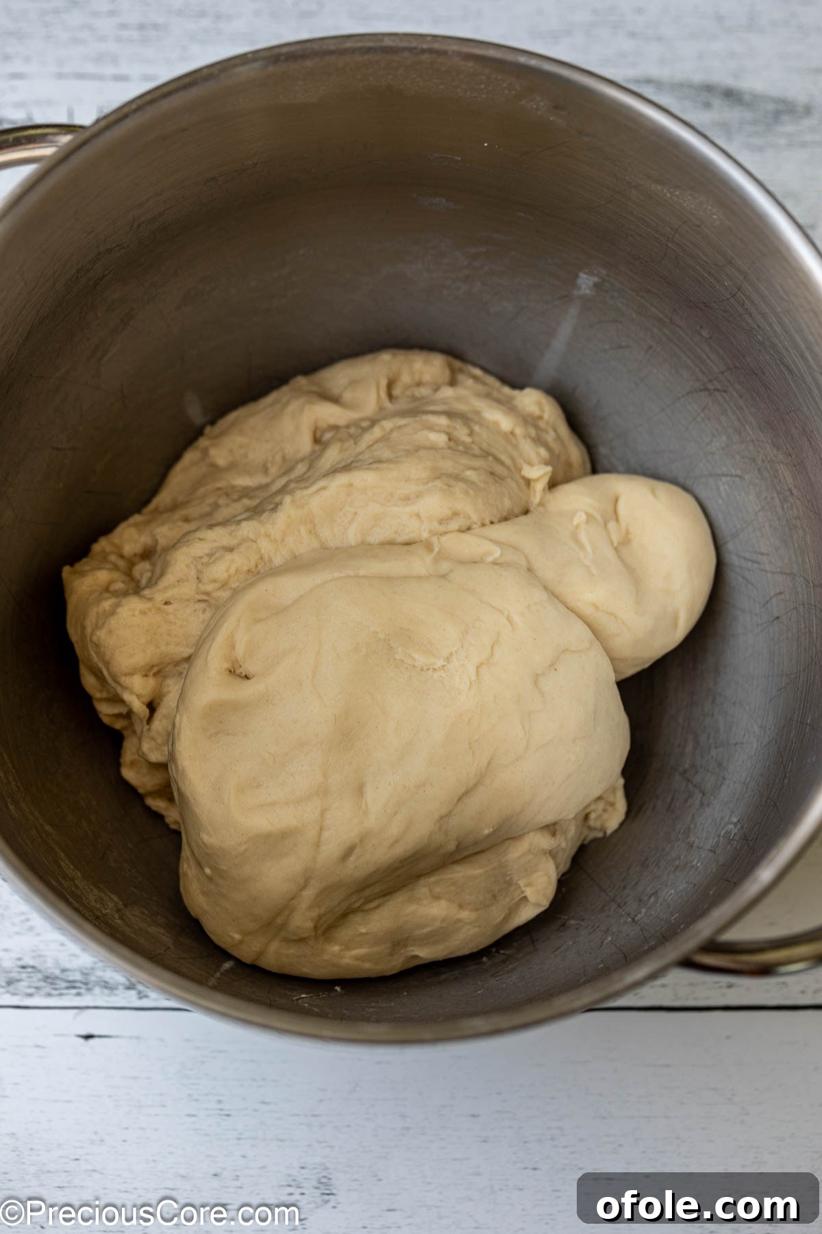 Luscious Strawberry Cinnamon Rolls 9 Soft, freshly kneaded cinnamon roll dough in a metal mixing bowl.