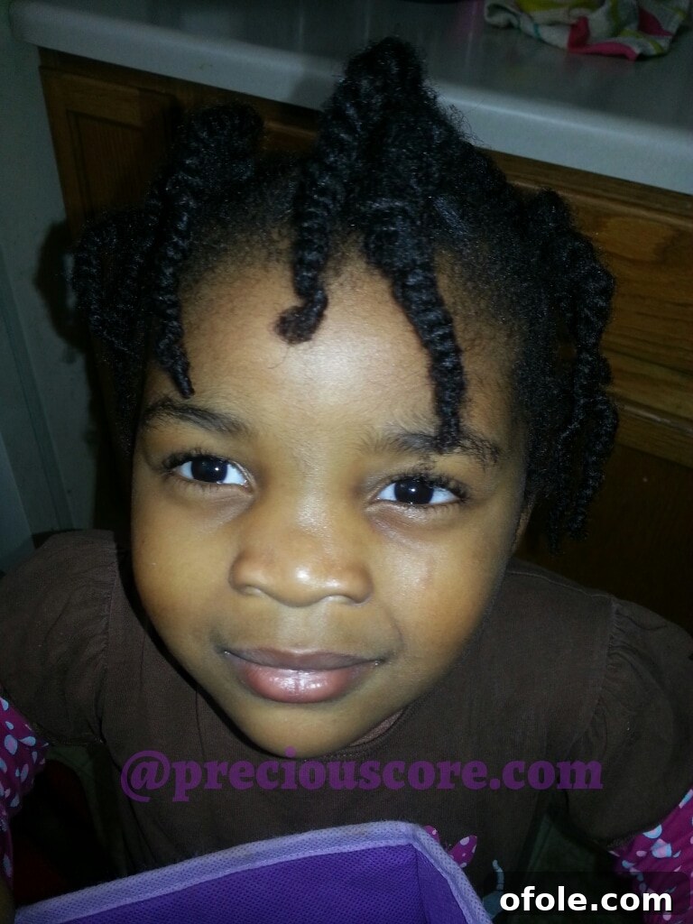 Girl number two's finished bigger natural hair twists