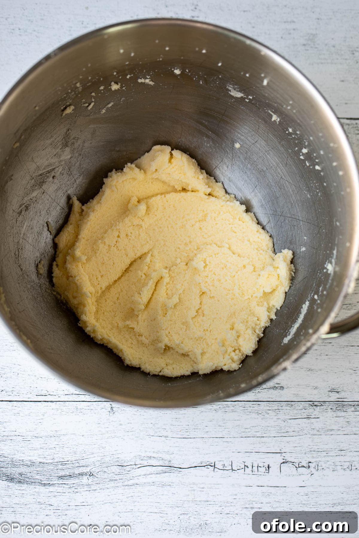 Effortless Everyday Cake 5 Close-up of butter and sugar expertly creamed together in a mixing bowl, showing a light and fluffy texture.