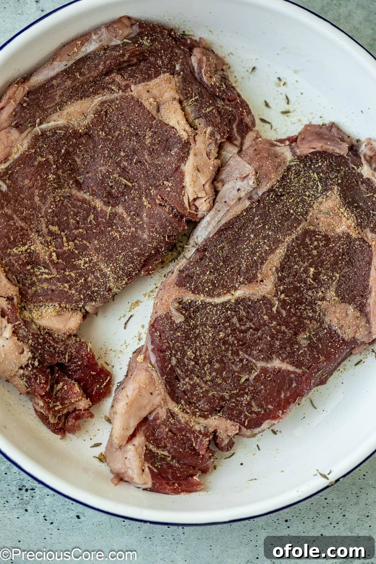 Elevated Ribeye Steak Sandwich 5 Seasoned raw ribeye steaks.