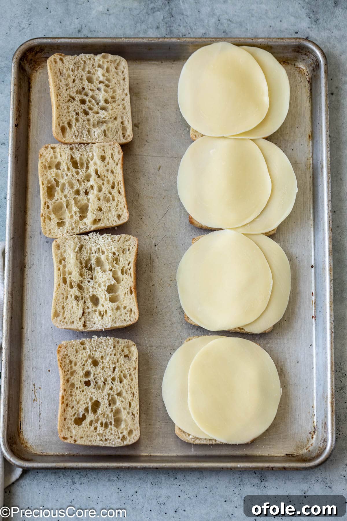 Elevated Ribeye Steak Sandwich 7 Ciabatta sandwich bread and cheese slices.