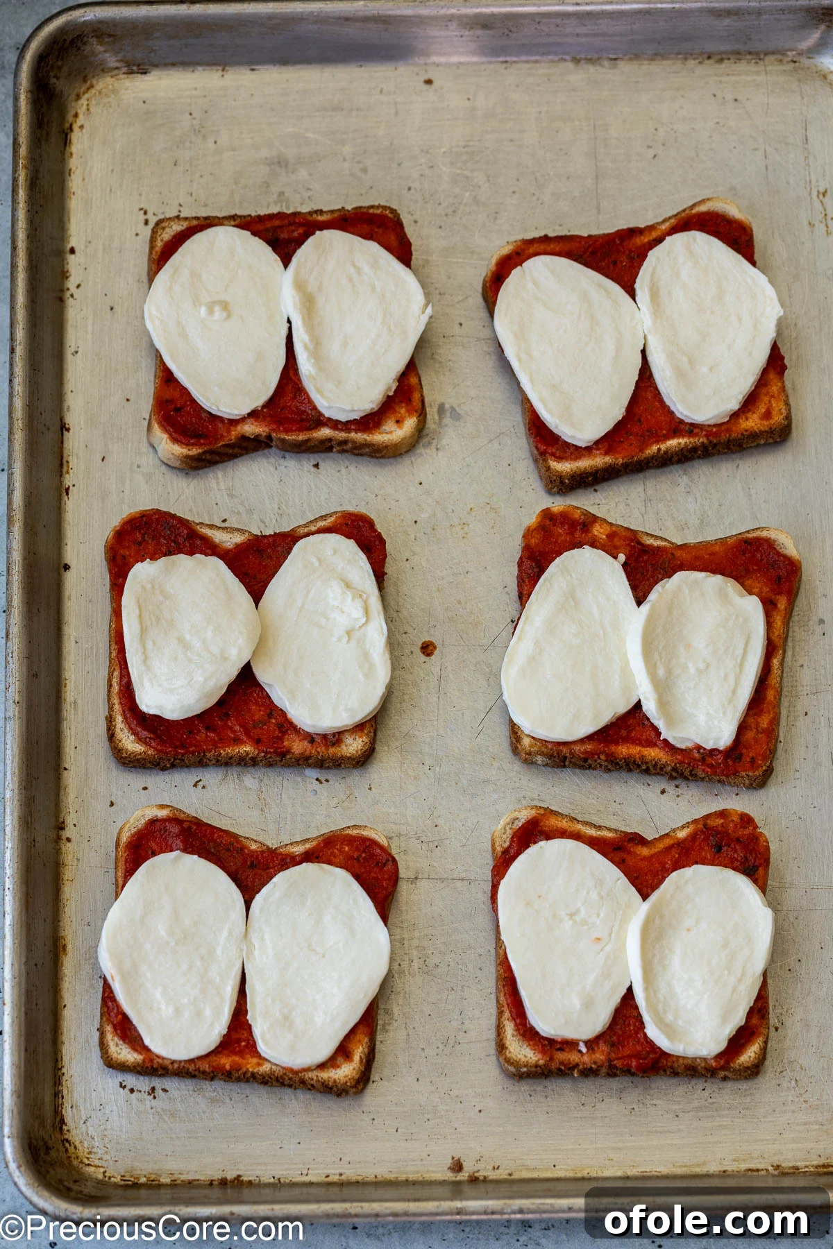 Fresh mozzarella on bread slices.