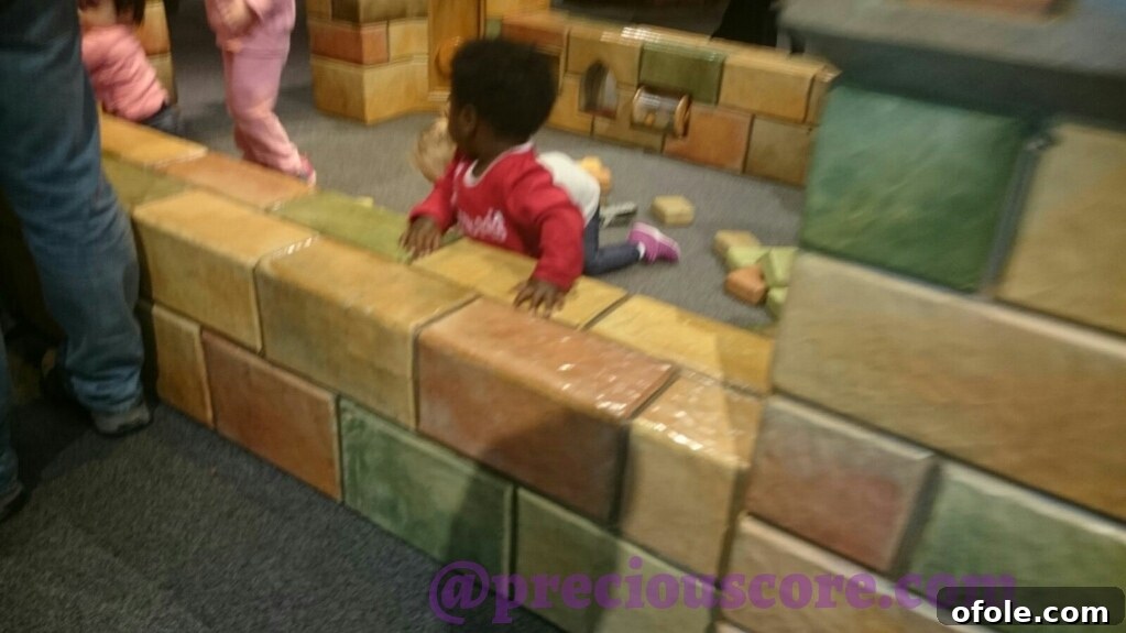 Photos and Quick Takes 3 Children enjoying an interactive exhibit at the museum.