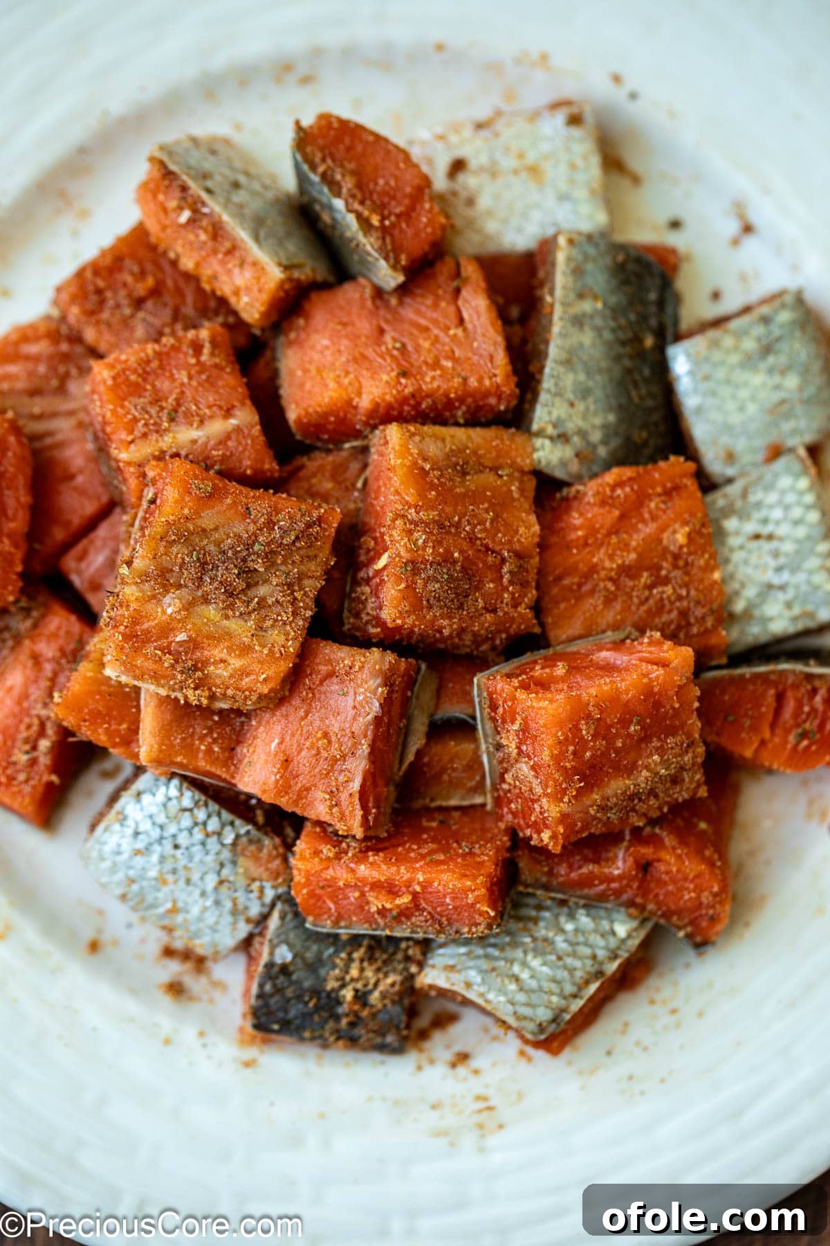 Spicy Cajun Salmon Pasta 7 Raw salmon seasoned with a rich blend of Cajun spices.
