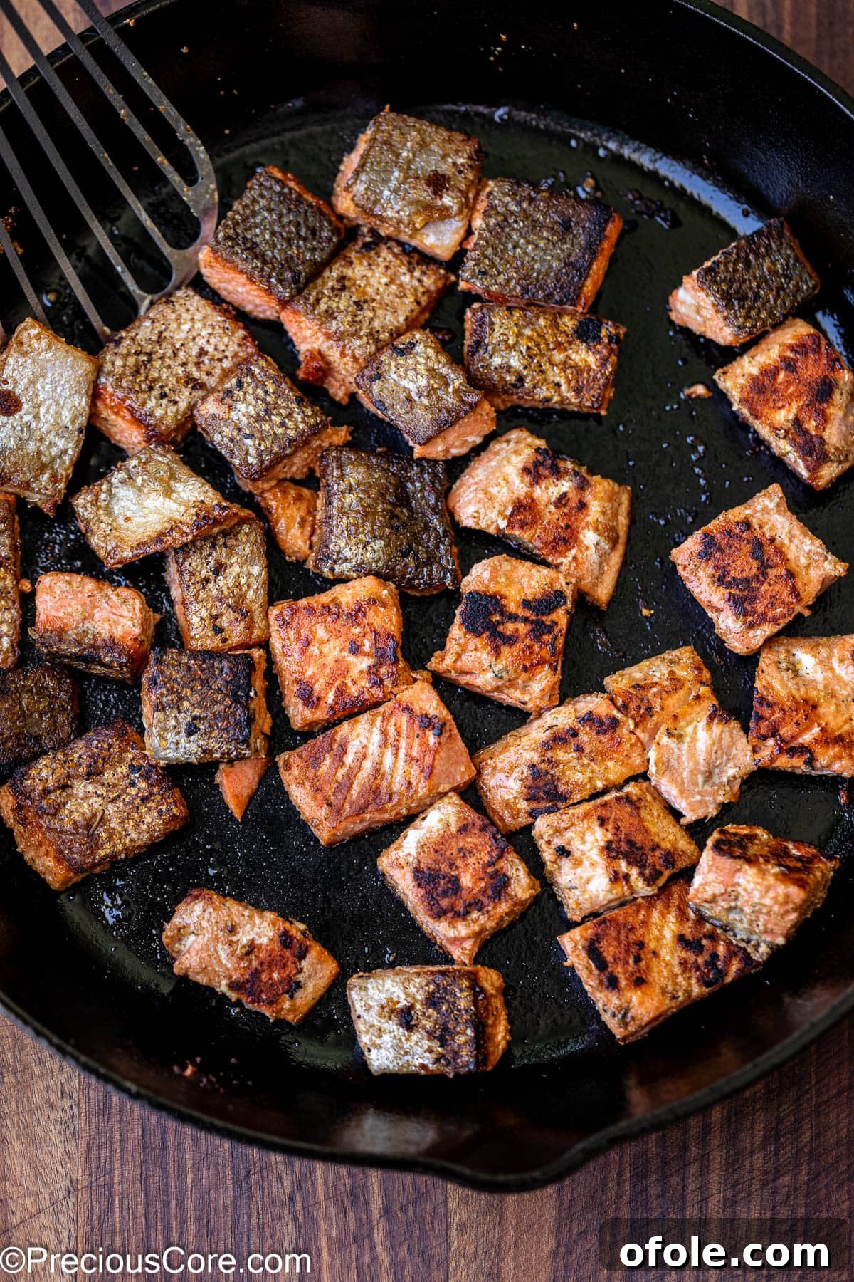 Spicy Cajun Salmon Pasta 8 Cooking salmon in a large skillet until golden brown.