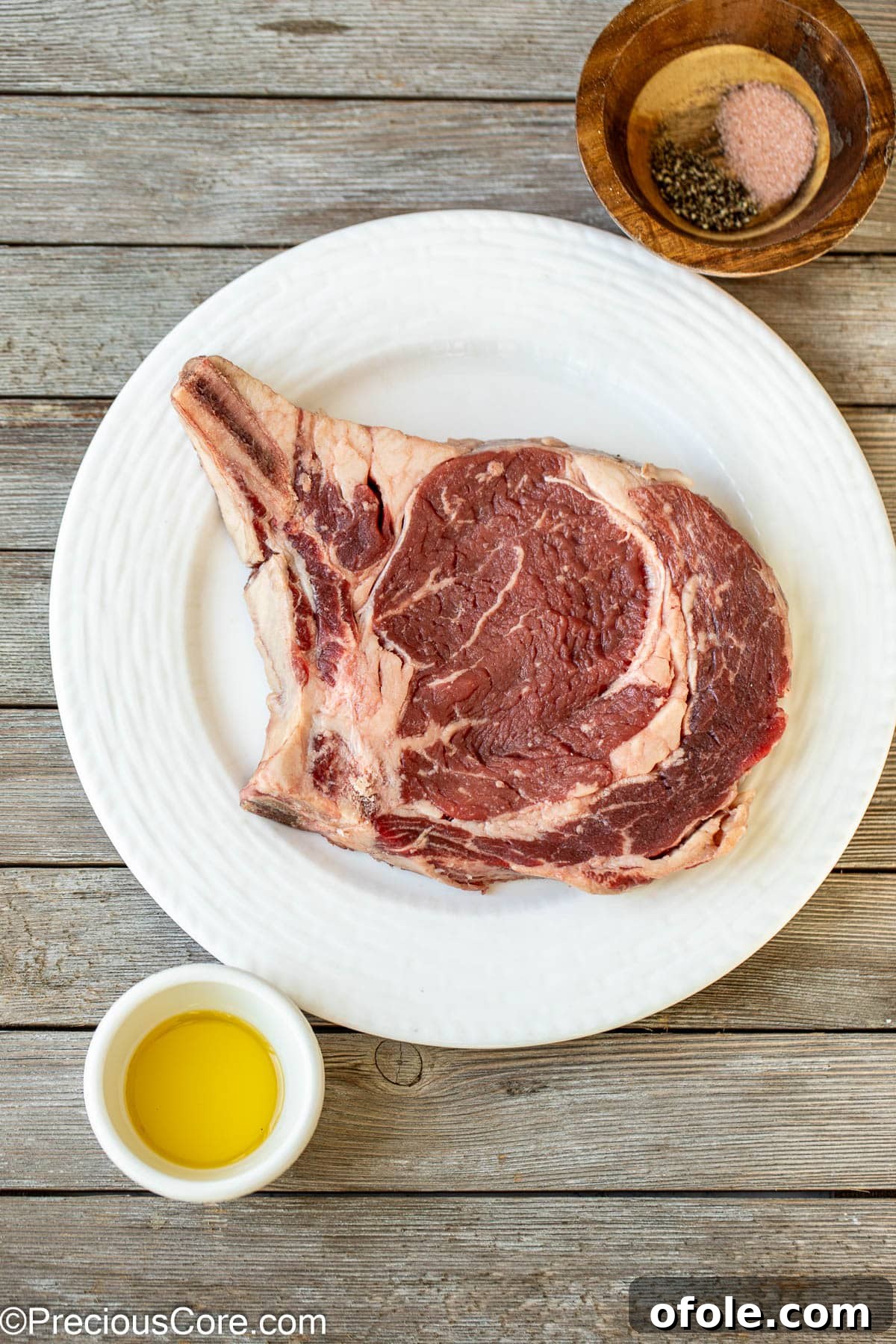 Prime Bone-In Ribeye 4 Steak, salt, black pepper, and olive oil.
