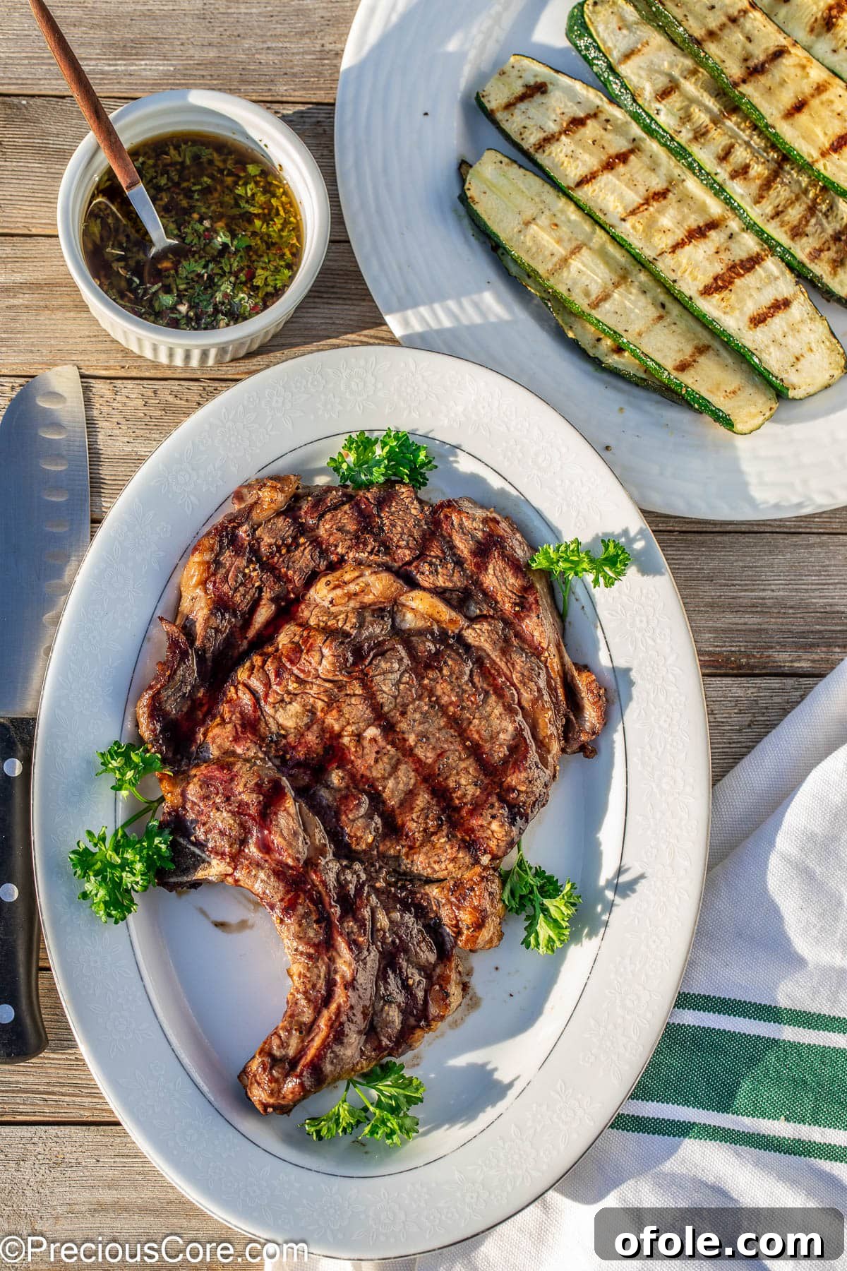 Prime Bone-In Ribeye 7 Summer steak and zucchini.