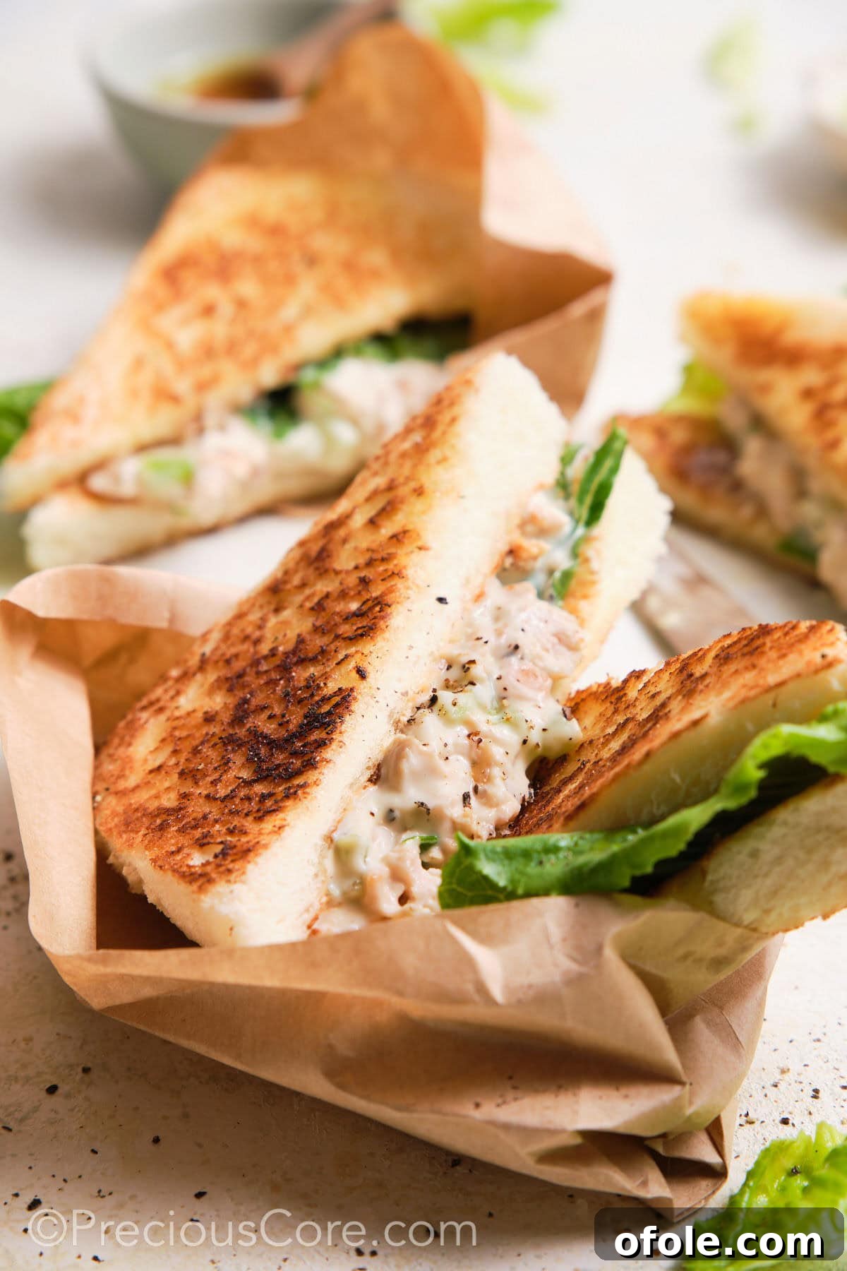 Creamy Chicken Sensation 4 Sandwich wrapped in sandwich paper.