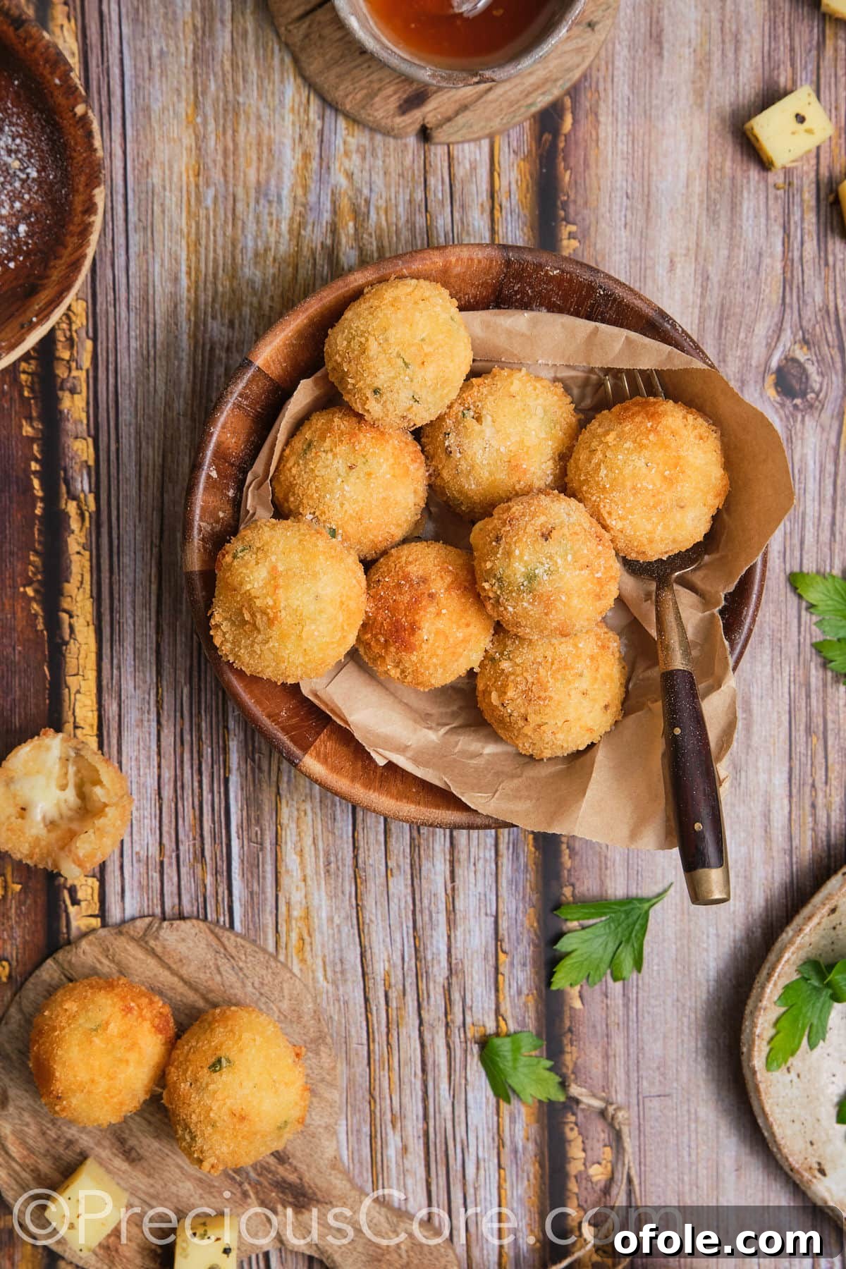 Golden brown balls of perfectly fried mashed potatoes, ready to be served.