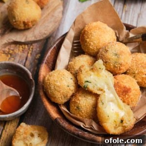 Square image of perfectly golden potato cheese balls.