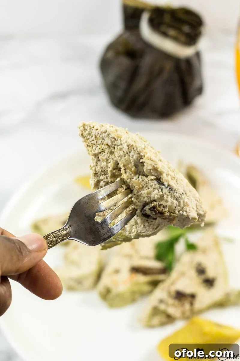 Deliciously steamed Egusi Pudding slices, showcasing a perfect texture and golden hue, ready to be served