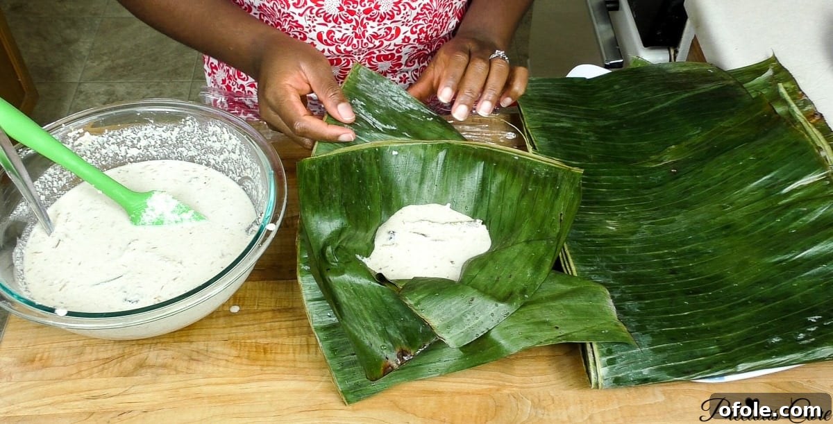 Stirring in smoked fish and shredded chicken or beef into the egusi mixture, preparing for bundling