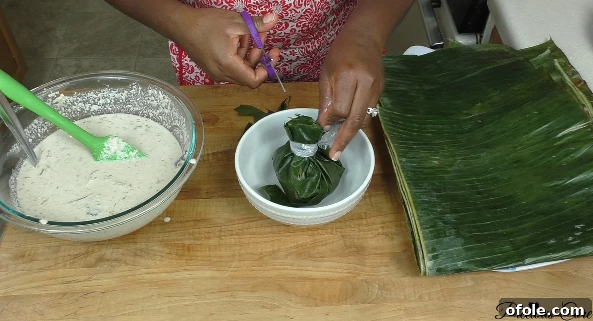 Banana leaves arranged in a bowl, ready to be filled with egusi pudding mixture for steaming
