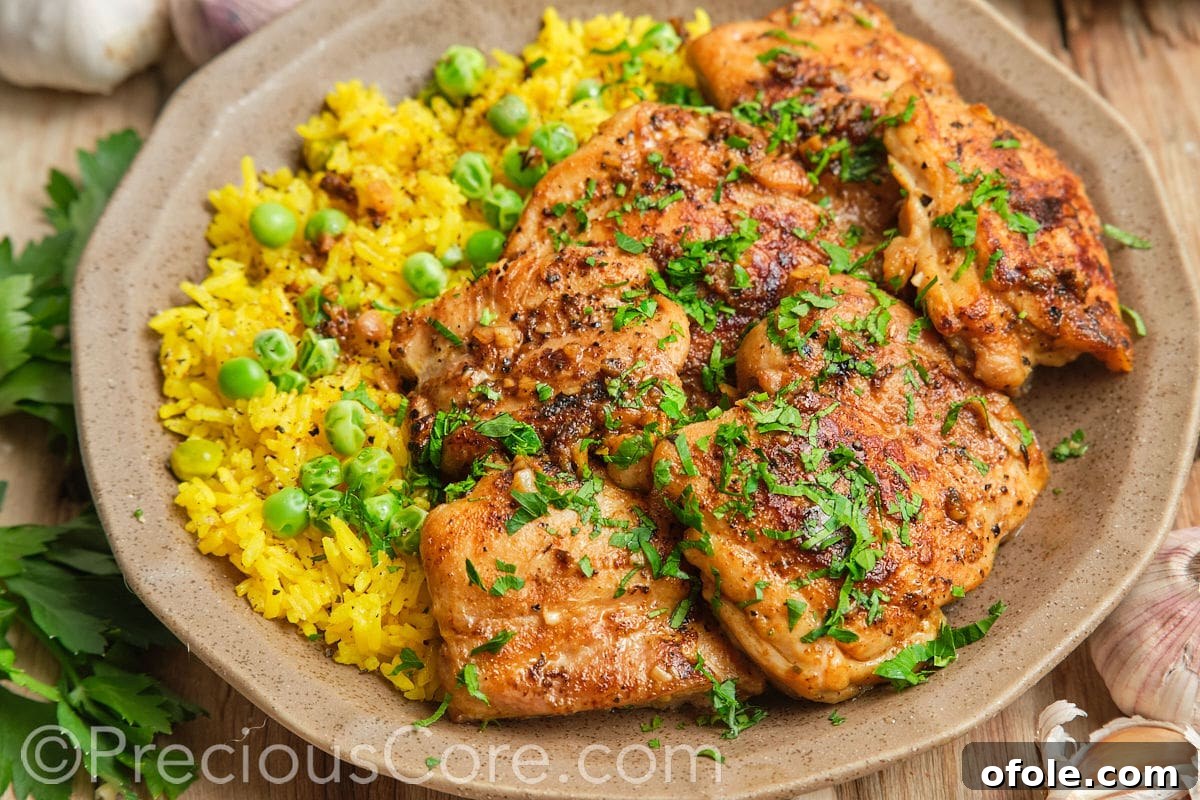 Juicy Skillet Chicken Thighs 5 Landscape image of perfectly pan-seared boneless chicken thighs resting after cooking.