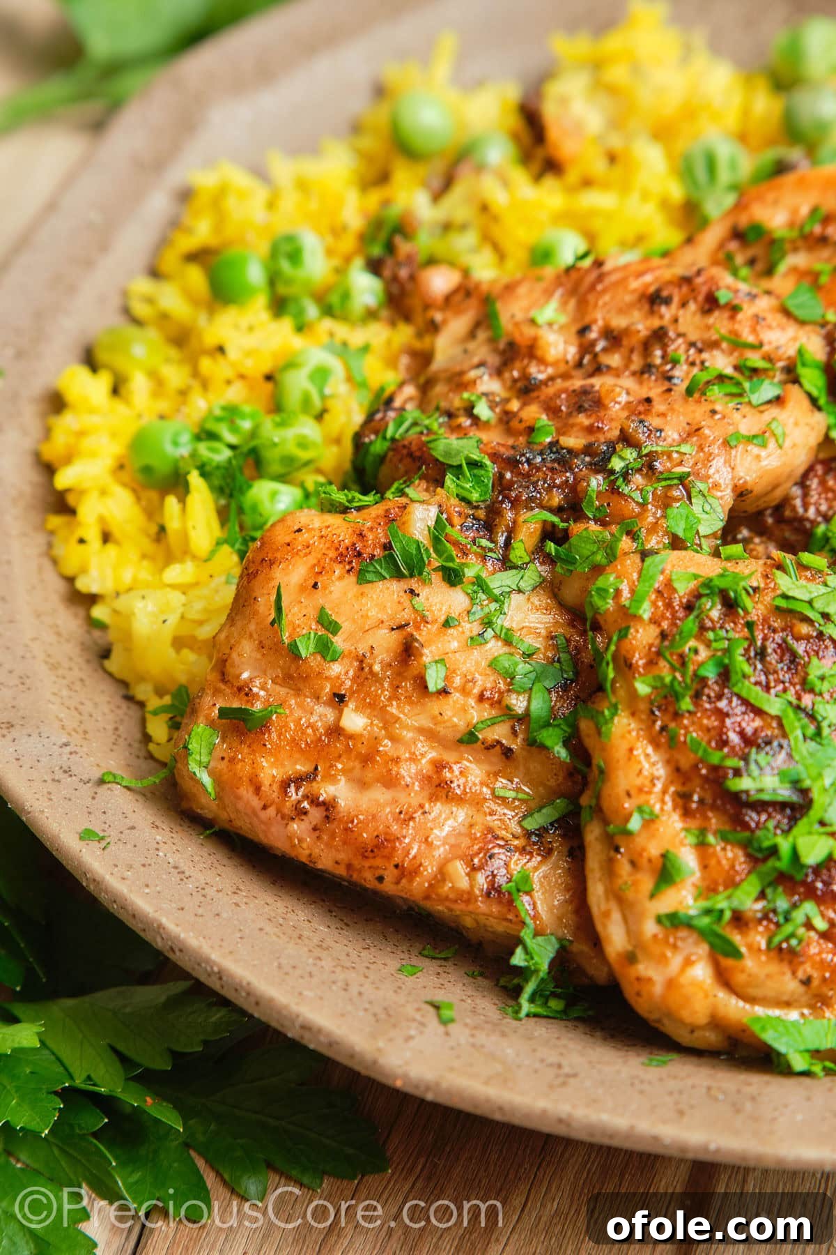 Juicy Skillet Chicken Thighs 6 Boneless skinless chicken thighs garnished generously with fresh parsley.