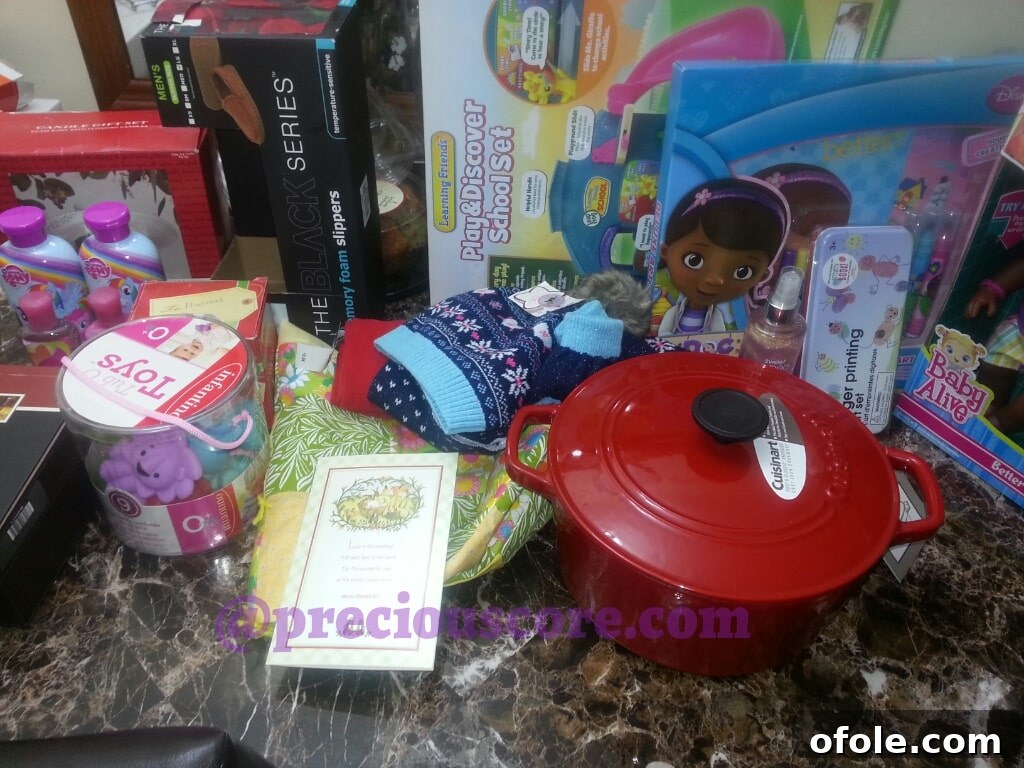 THINGS YOU WON'T BELIEVE: A SHOCKING REVELATION 4 A collection of various gifts including kitchenware, a doll, and other household items, showcasing a thoughtful selection.