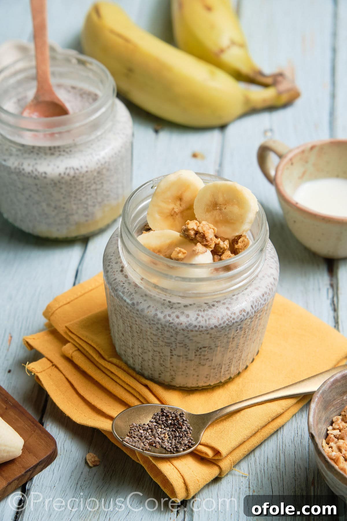 Two glass jars filled with homemade banana chia pudding, ready to be enjoyed.