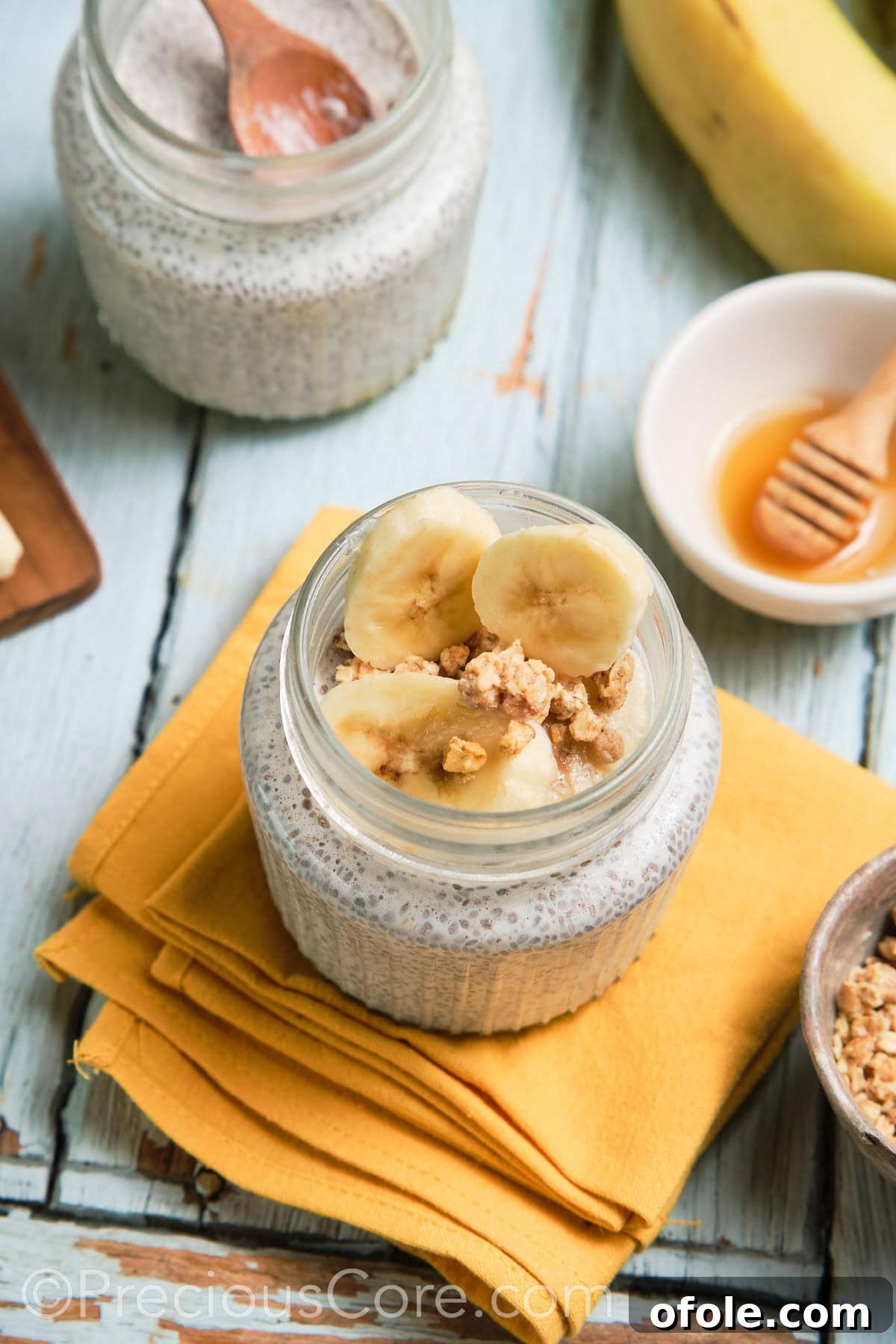 Prepared chia pudding in two elegant glass jars, ready for toppings.