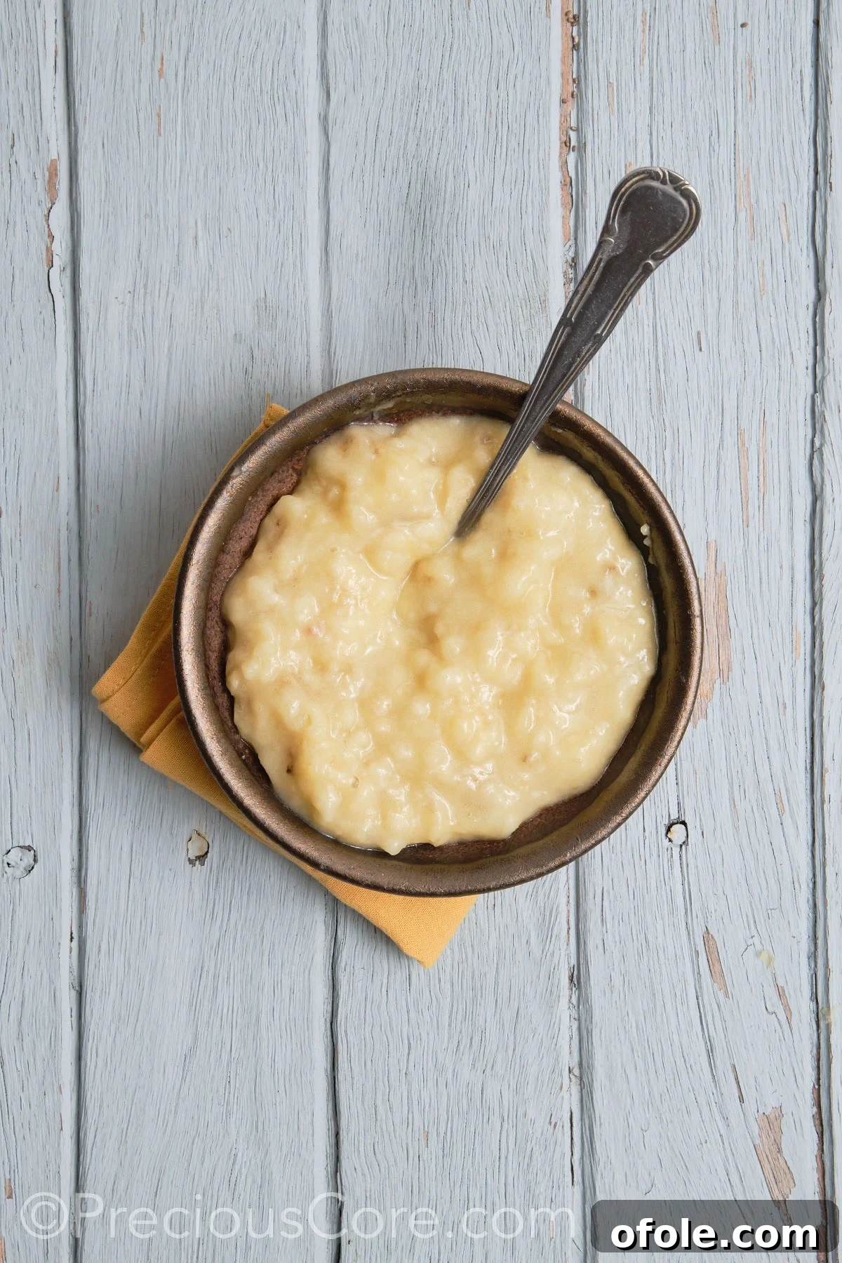 Perfectly mashed bananas in a white bowl, ready for the next step.