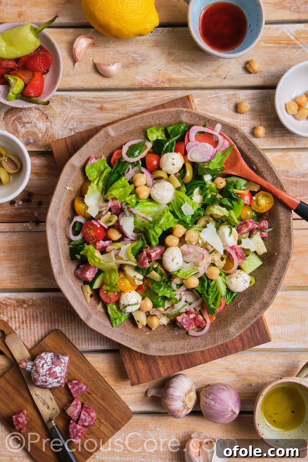Ultimate Italian Chopped Salad 3 A close-up of a vibrant chopped salad, showcasing its fresh ingredients in a stylish brown bowl.