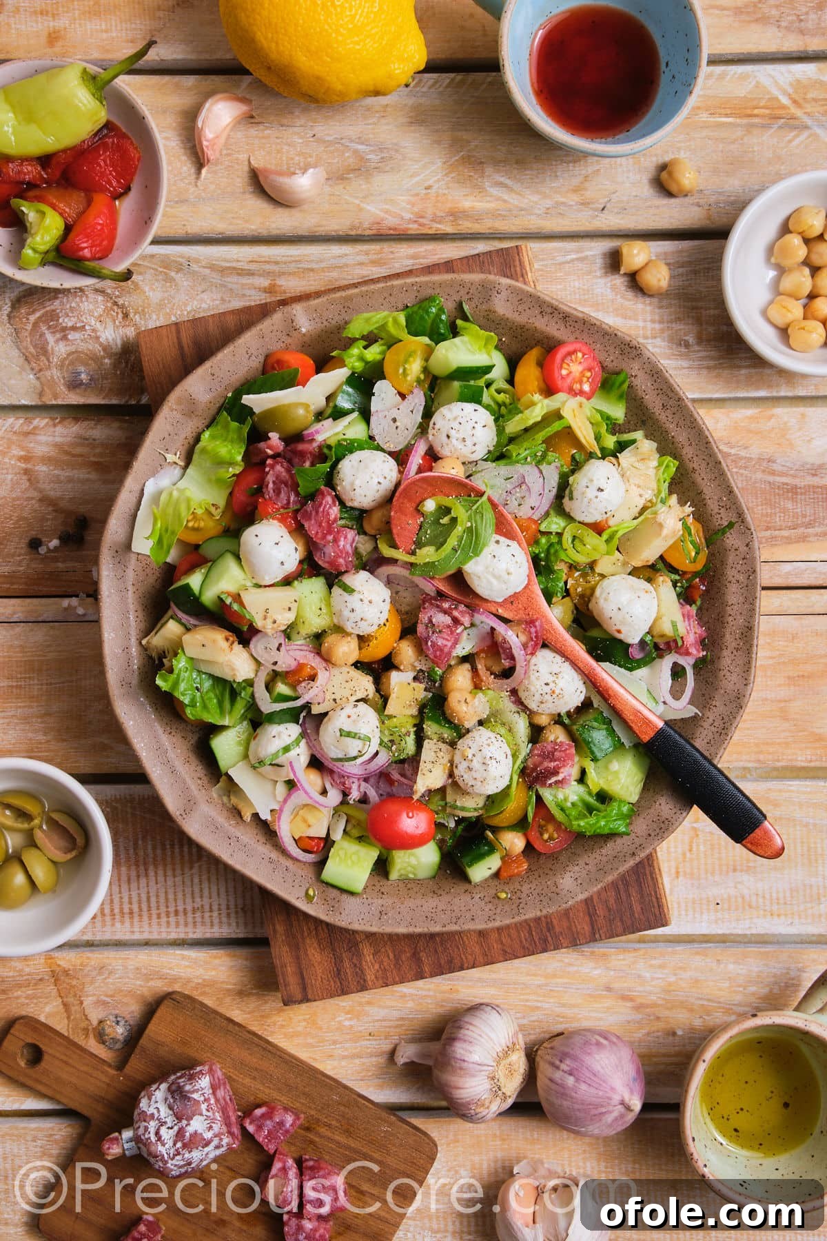 Ultimate Italian Chopped Salad 6 A vibrant and colorful bowl of chopped salad, ready to be tossed and served.