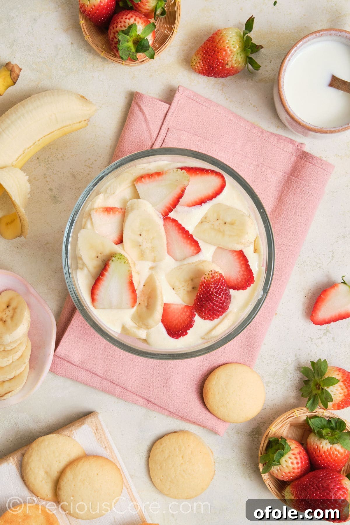 Dreamy Strawberry Banana Pudding 14 Multiple layers of pudding, strawberries, and bananas visible in a clear trifle bowl, building up the dessert.