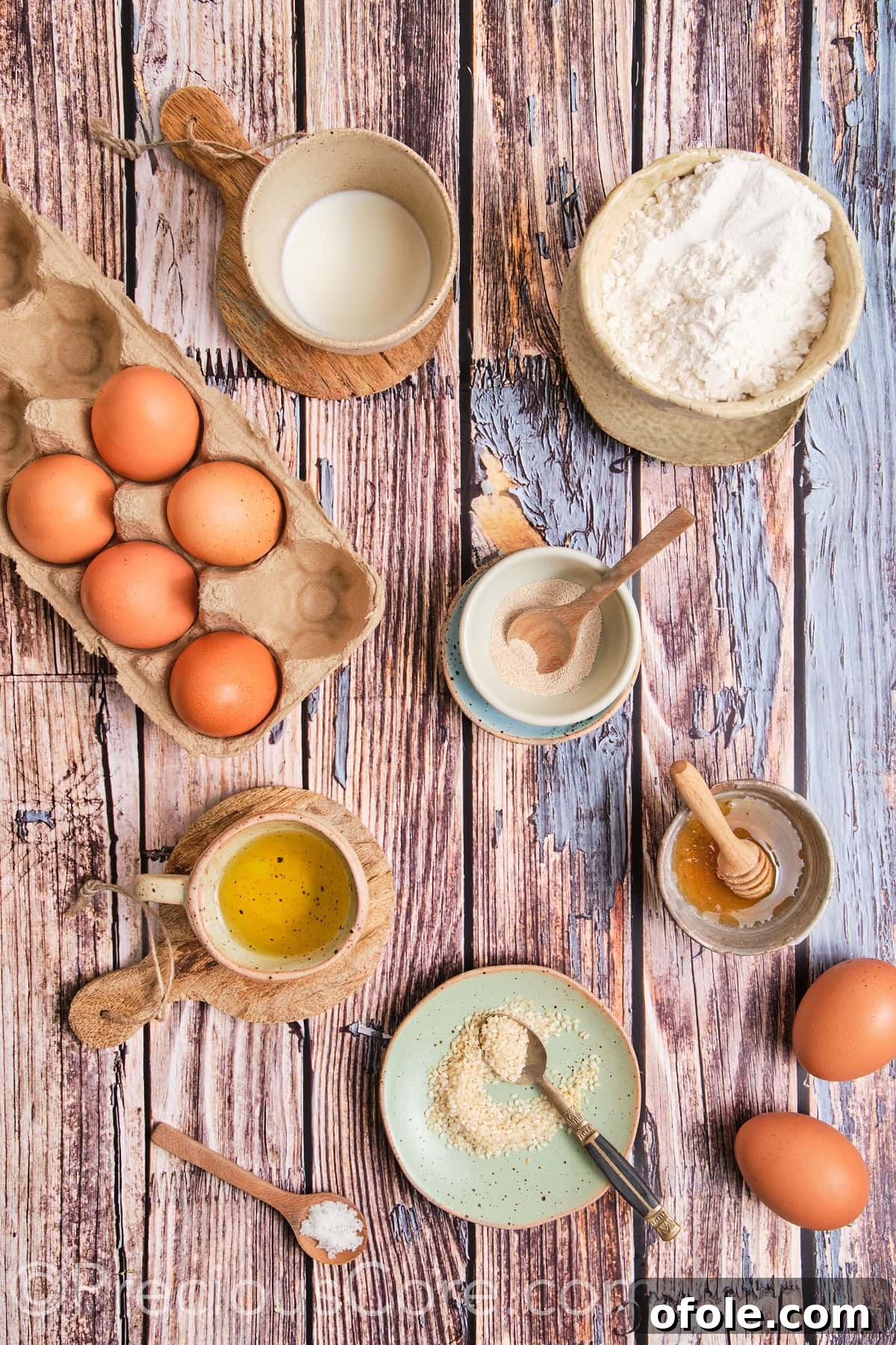 A flat lay of all ingredients for Challah Dinner Rolls, neatly arranged.