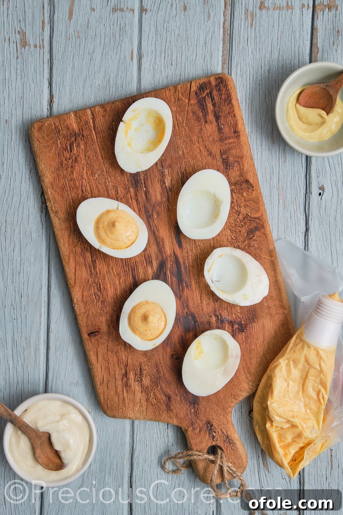 Cajun Shrimp Deviled Eggs 19 egg halves with egg yolk mixture scooped.