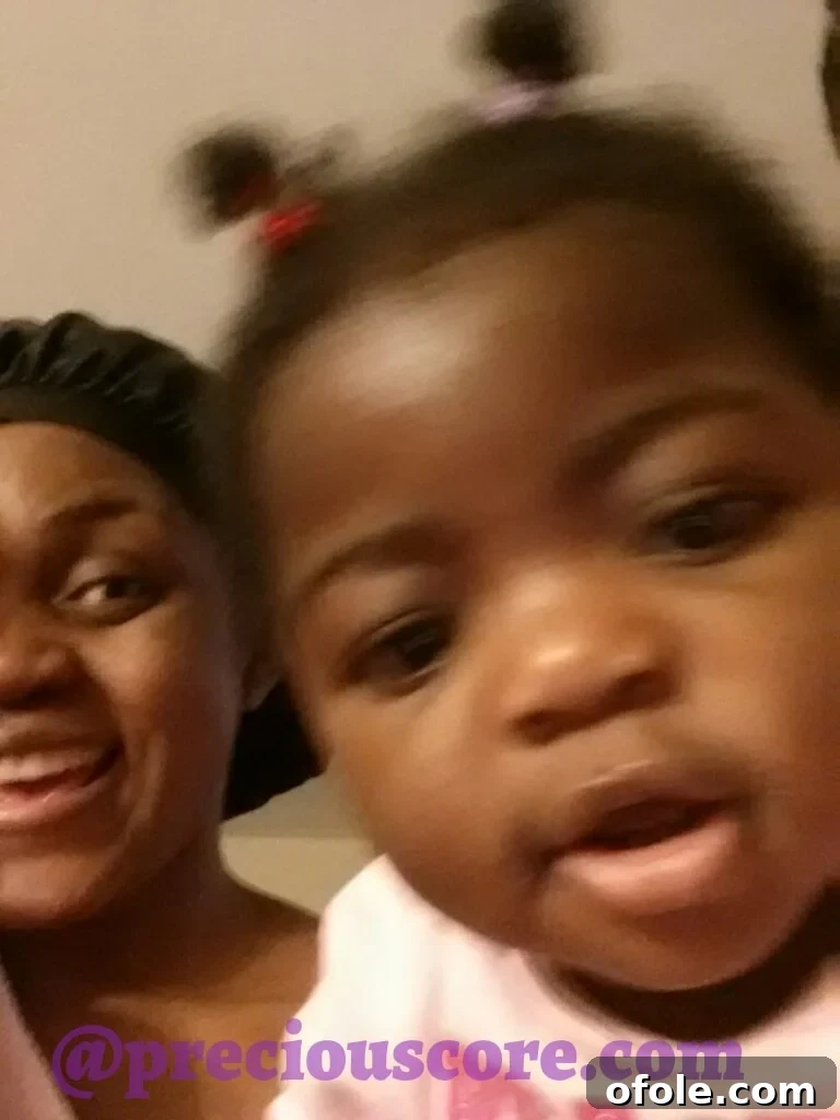 A slightly blurry but heartwarming photo of a mother and her child.