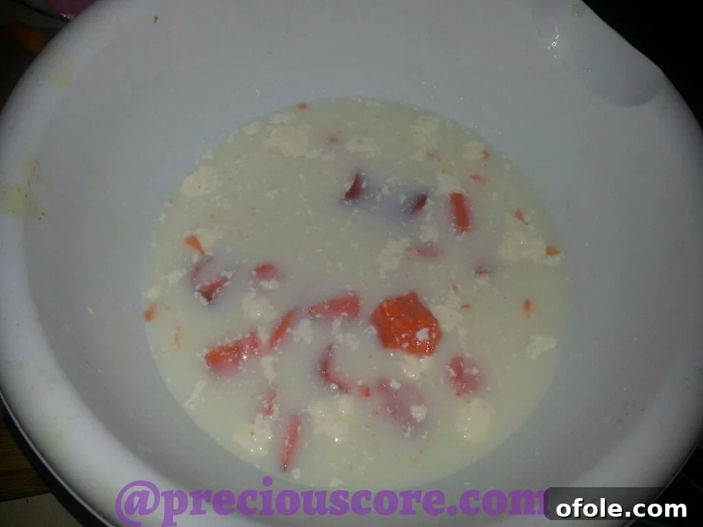 Child's attempt at making Cole Slaw, a humorous mix of milk, mayonnaise, and raw carrots.