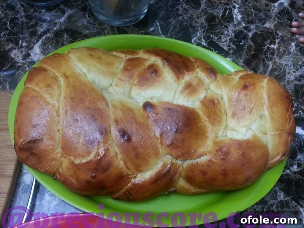 Freshly baked golden-brown Challah bread.