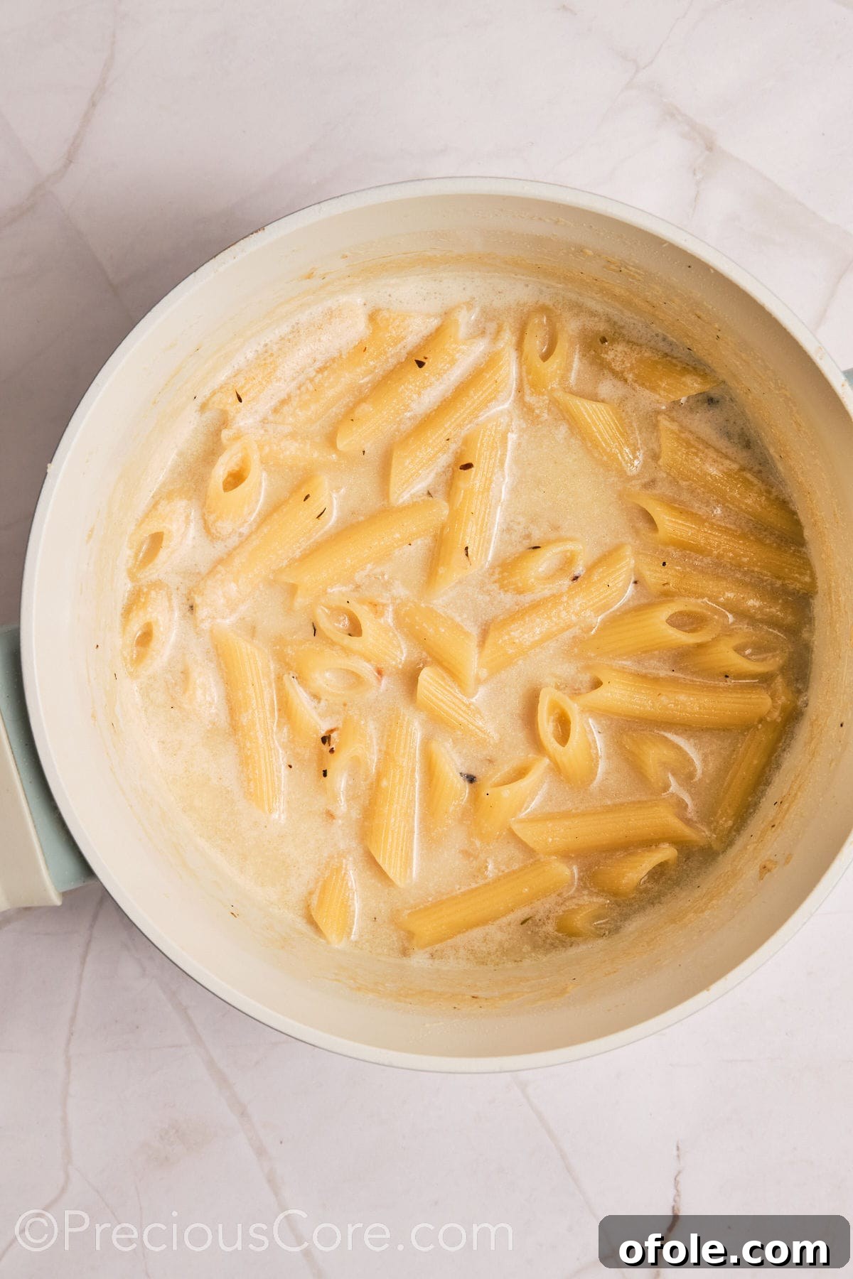 One Pot Wonder Creamy Chicken Pasta 12 Pasta added to creamy liquid.