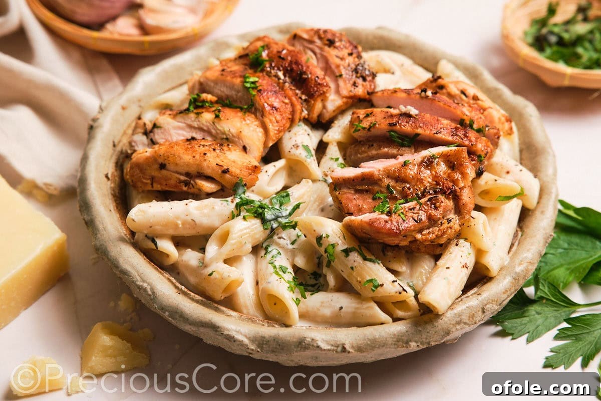 One Pot Wonder Creamy Chicken Pasta 19 Creamy pasta topped with sliced boneless chicken thighs.