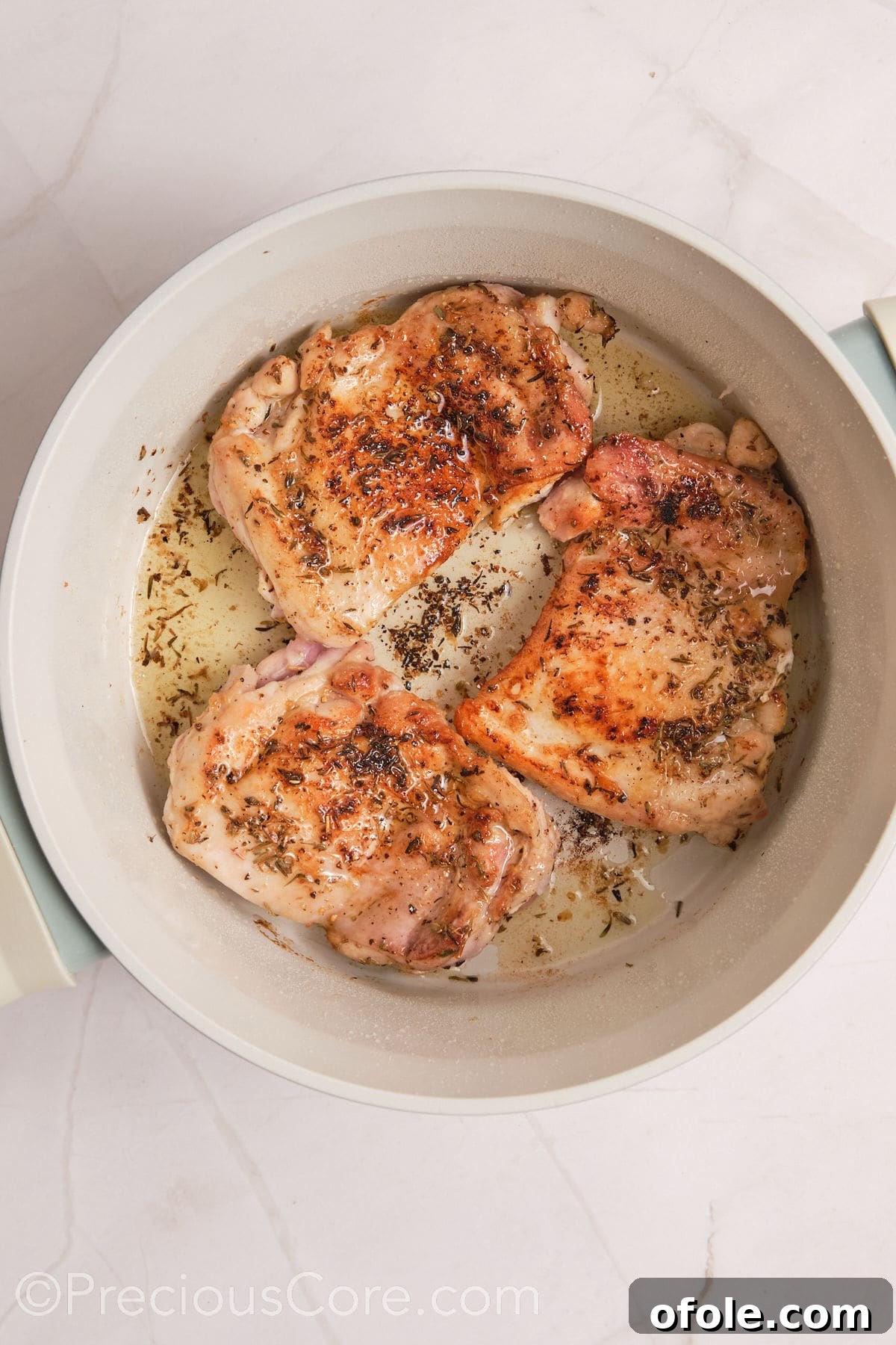 One Pot Wonder Creamy Chicken Pasta 9 Browned chicken thighs in a pot.