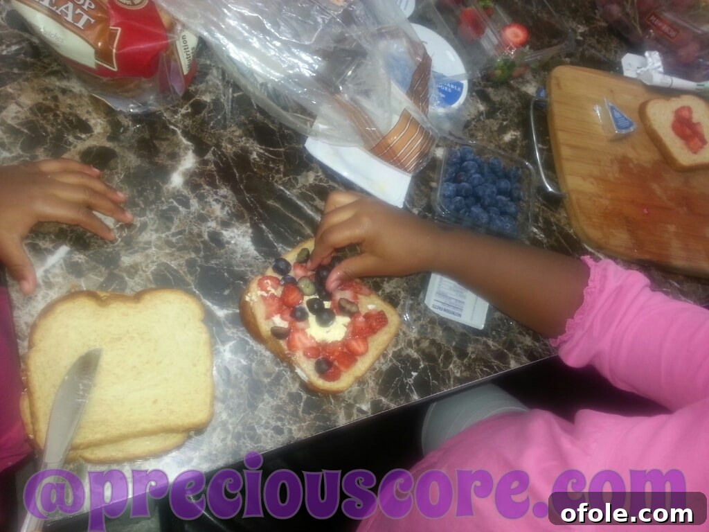 A homemade fruit sandwich, thoughtfully and creatively prepared by a child for breakfast.