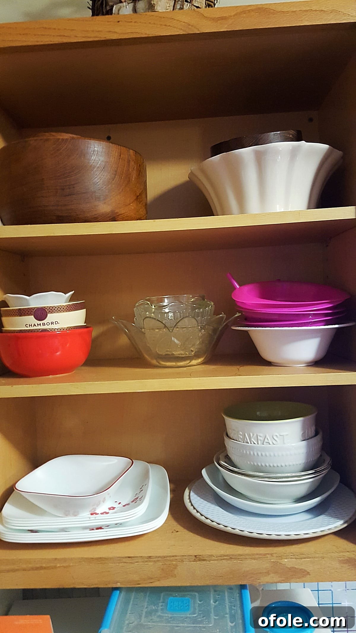 From Chaos to Calm My Kitchen Decluttering Story 3 Neatly organized plates cabinet after decluttering, showing ample space and fewer items