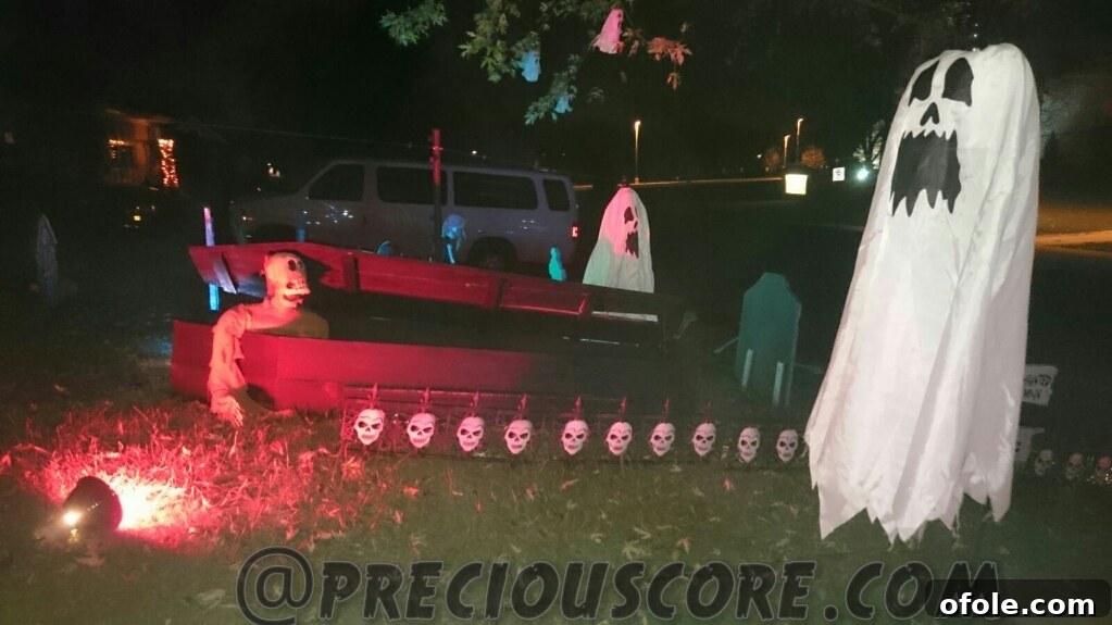 A wide, panoramic view of an exceptionally elaborate and detailed Halloween display, suggesting multiple themed zones or a highly complex setup that extends across a large area.
