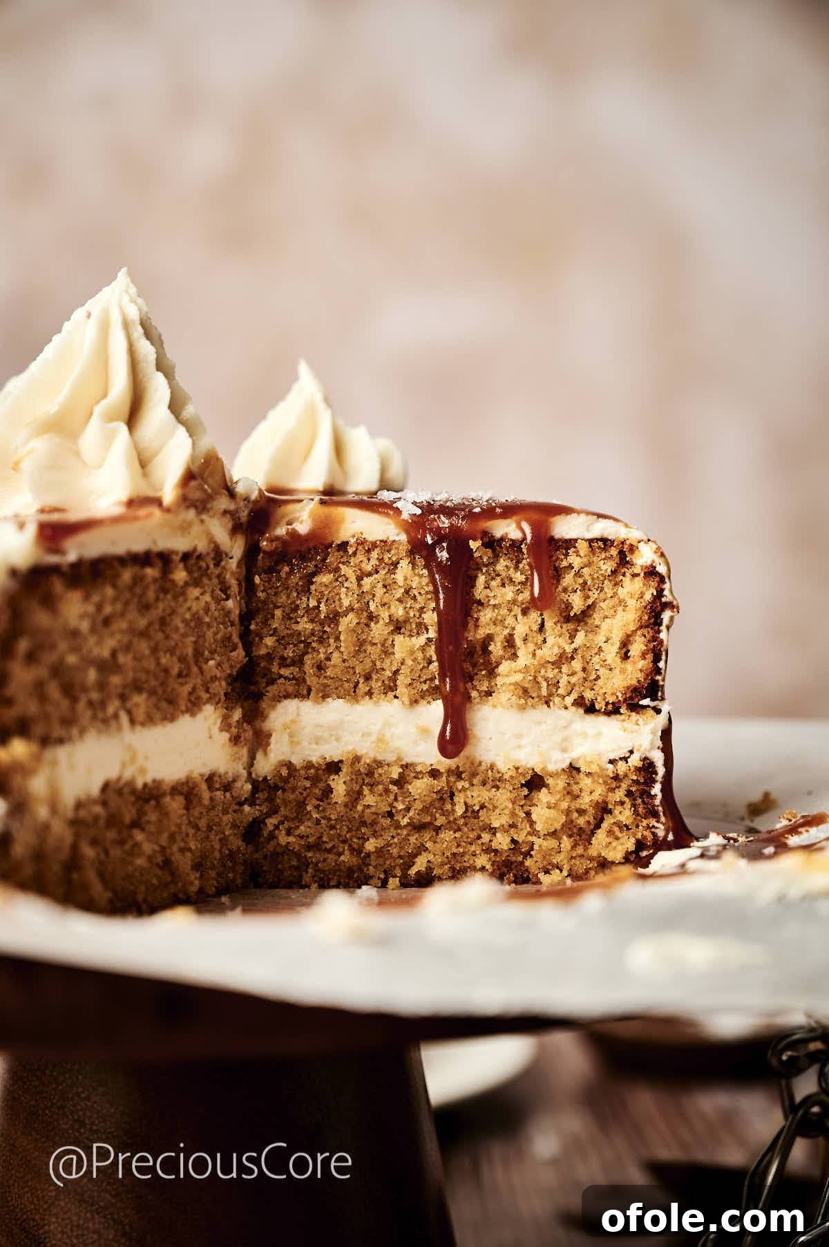 Salted Caramel Dream Cake 16 A slice of salted caramel cake, perfectly cut to reveal its moist layers and creamy frosting, ready to be enjoyed.
