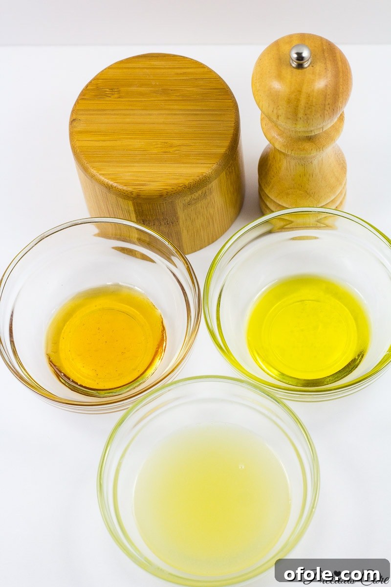 Crimson & Emerald Harvest 2 Ingredients for homemade honey lemon dressing: fresh lemon, golden honey, premium extra virgin olive oil, sea salt, and ground black pepper