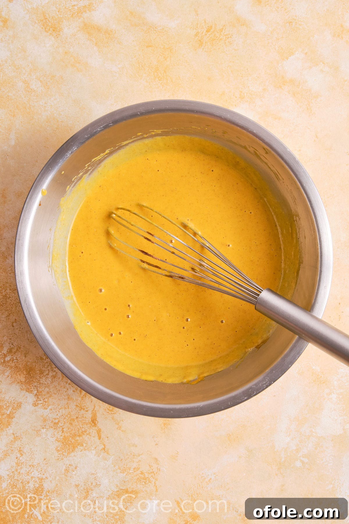 Creamy Pumpkin Pie Without Evaporated Milk 12 The fully mixed pumpkin pie filling, a smooth and creamy orange mixture, ready to be poured into the pie crust.