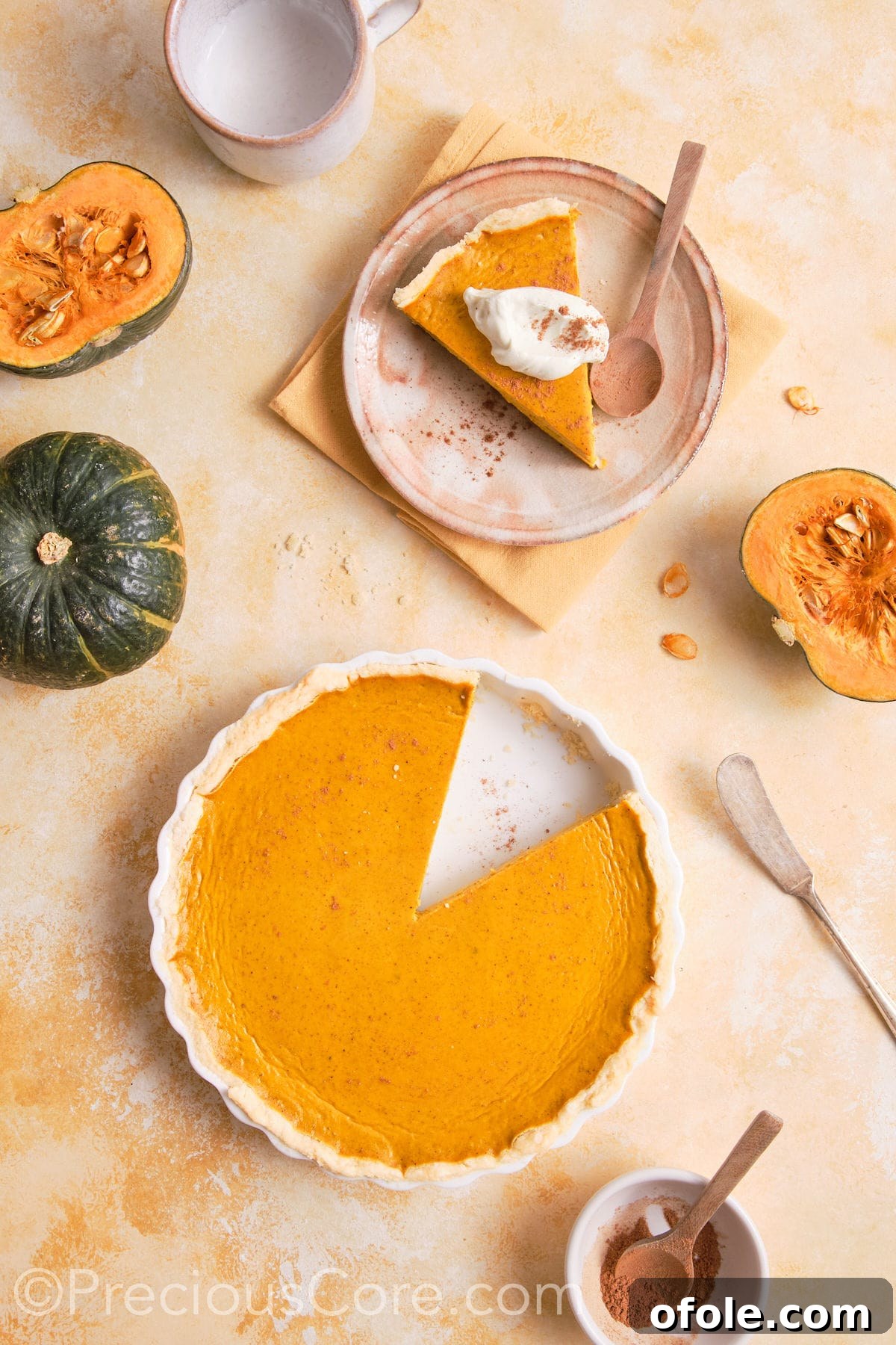 Creamy Pumpkin Pie Without Evaporated Milk 5 A whole pumpkin pie with no evaporated milk, perfectly baked and cooling in a white ceramic pie dish on a wooden surface.