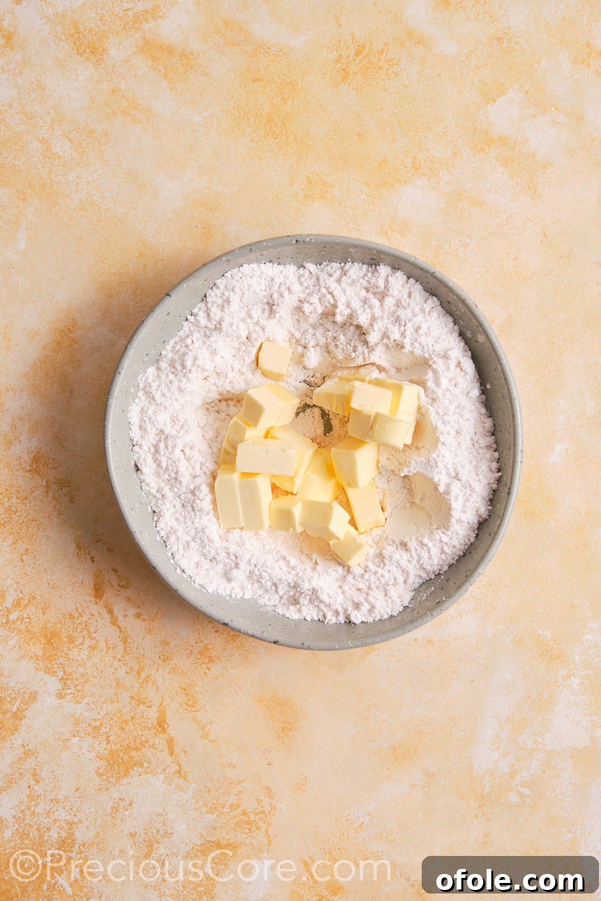 Creamy Pumpkin Pie Without Evaporated Milk 8 Cold butter cubes partially cut into a mixture of flour, salt, and sugar in a mixing bowl, forming coarse crumbs.