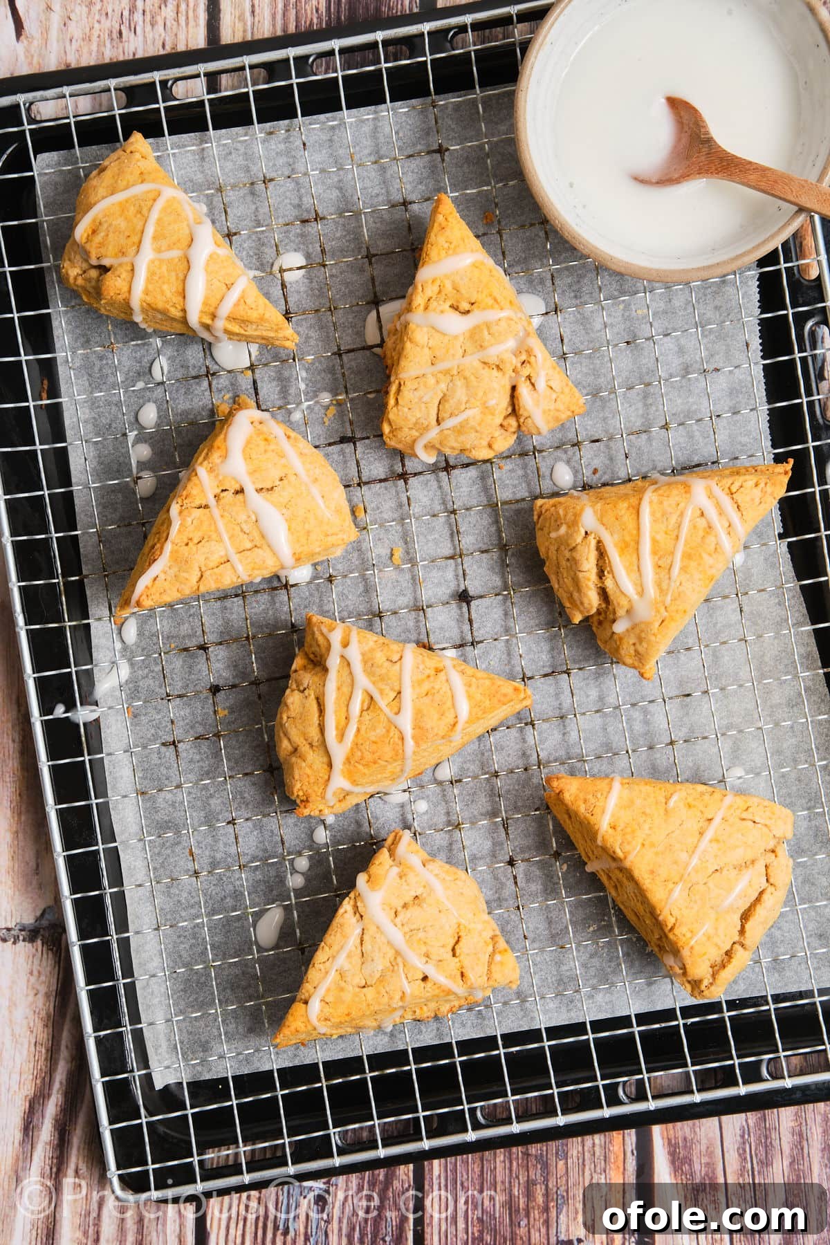 Spiced Sweet Potato Scones 18 Sweet potato scones, now beautifully drizzled with a simple white glaze, showcased on a wire rack.