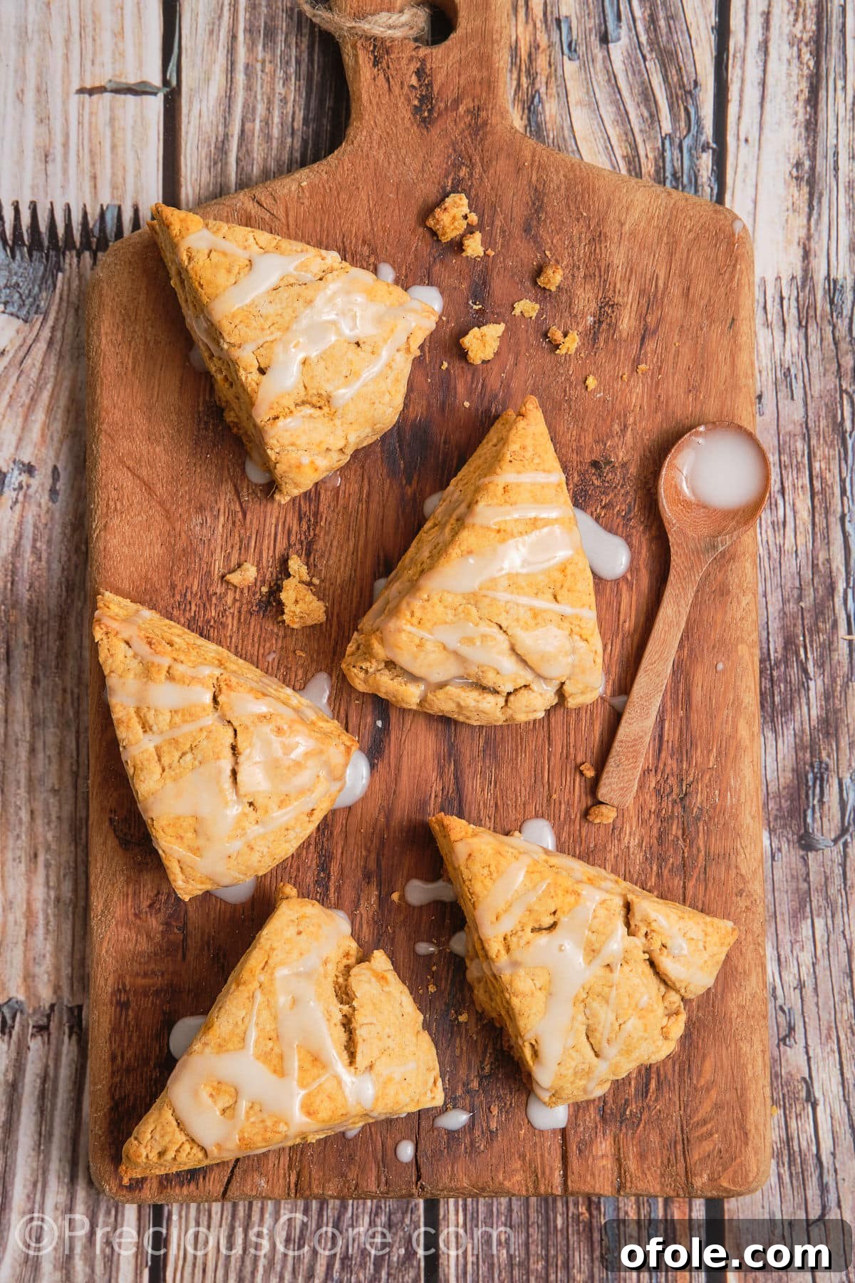 Golden Sweet Potato Scones 19 A vibrant display of sweet potato scones, each adorned with a delicate white glaze, perfectly positioned for a captivating photograph.