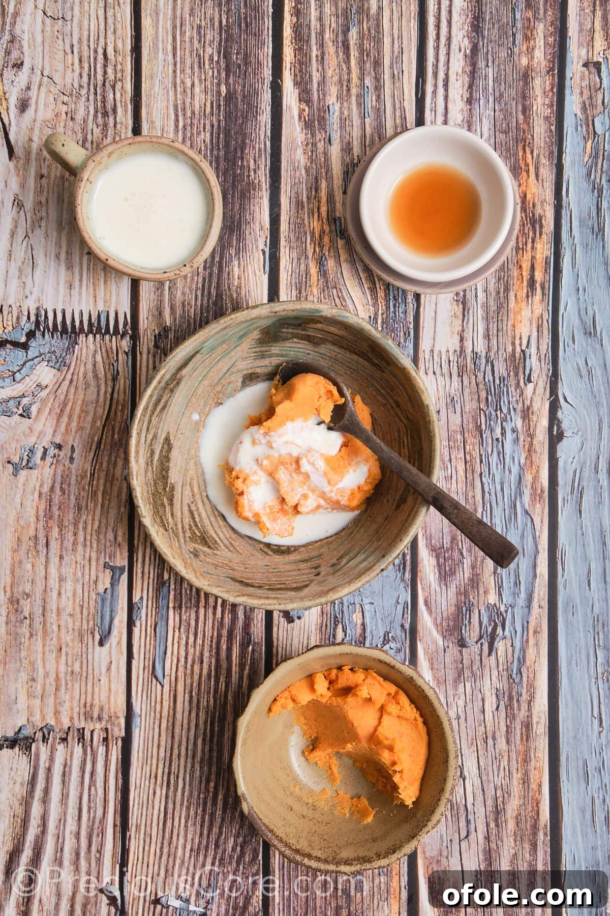 Spiced Sweet Potato Scones 10 Mashed sweet potato, buttermilk, and vanilla extract are whisked together in a small bowl to create a smooth, vibrant wet mixture.